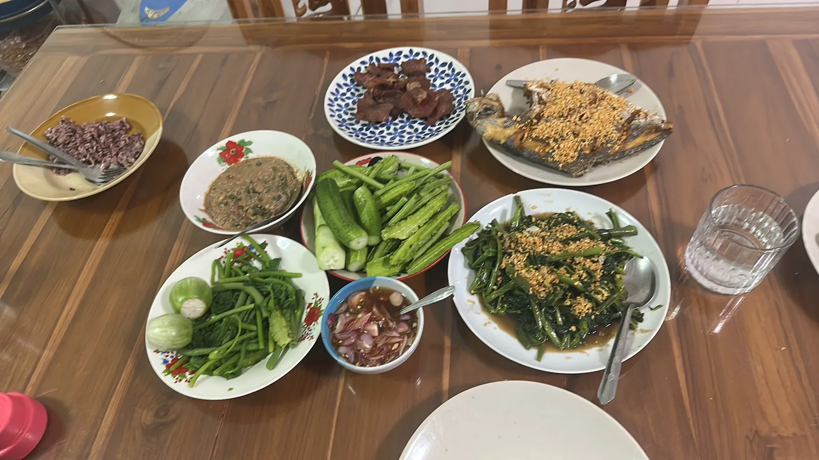 Dinner of fried fish and fresh vegetables