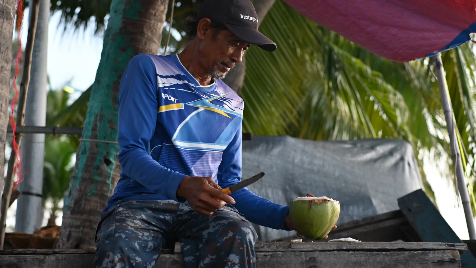 Vendeur de noix de coco à Ranong